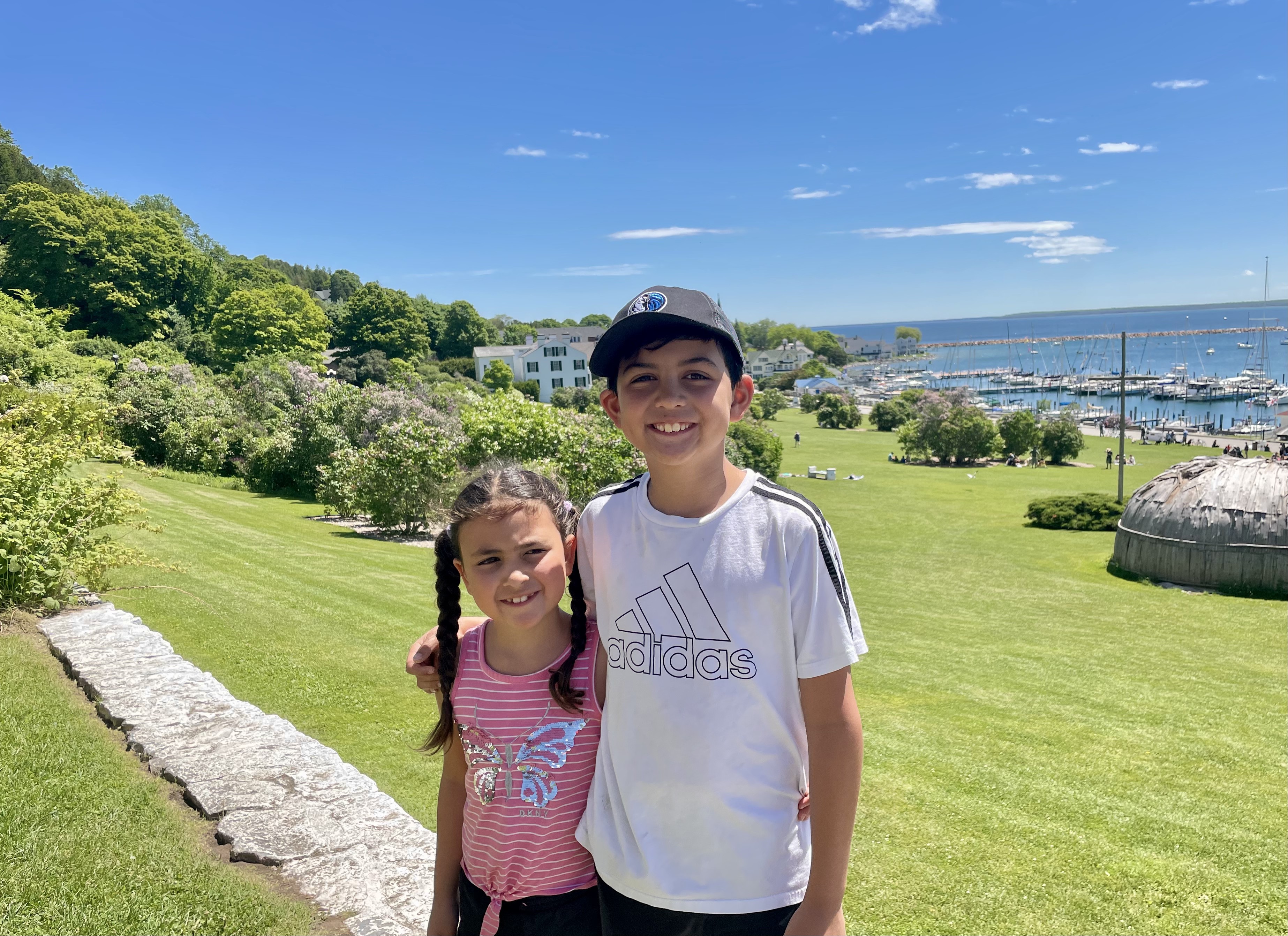 Chance and Kaitlyn on the Grand Hotel lawn with marina in background