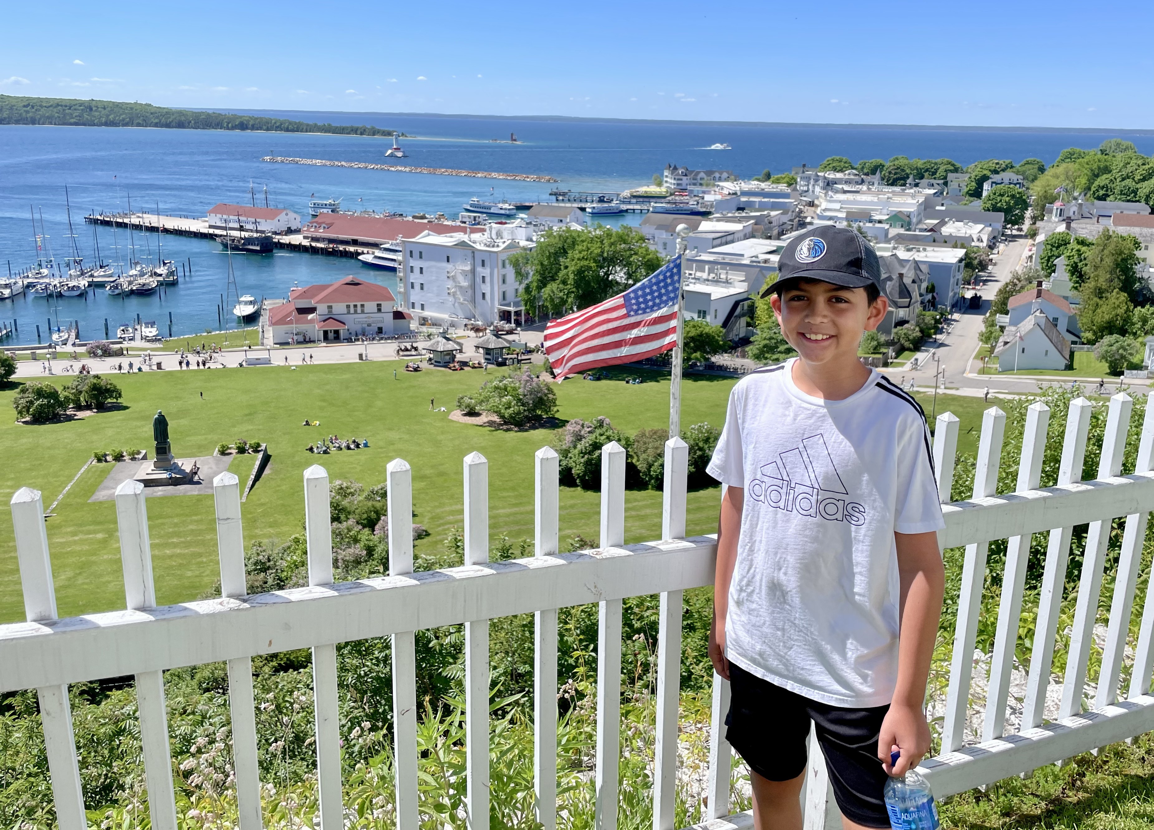 Chance at Fort Mackinac overlook with harbor and town below