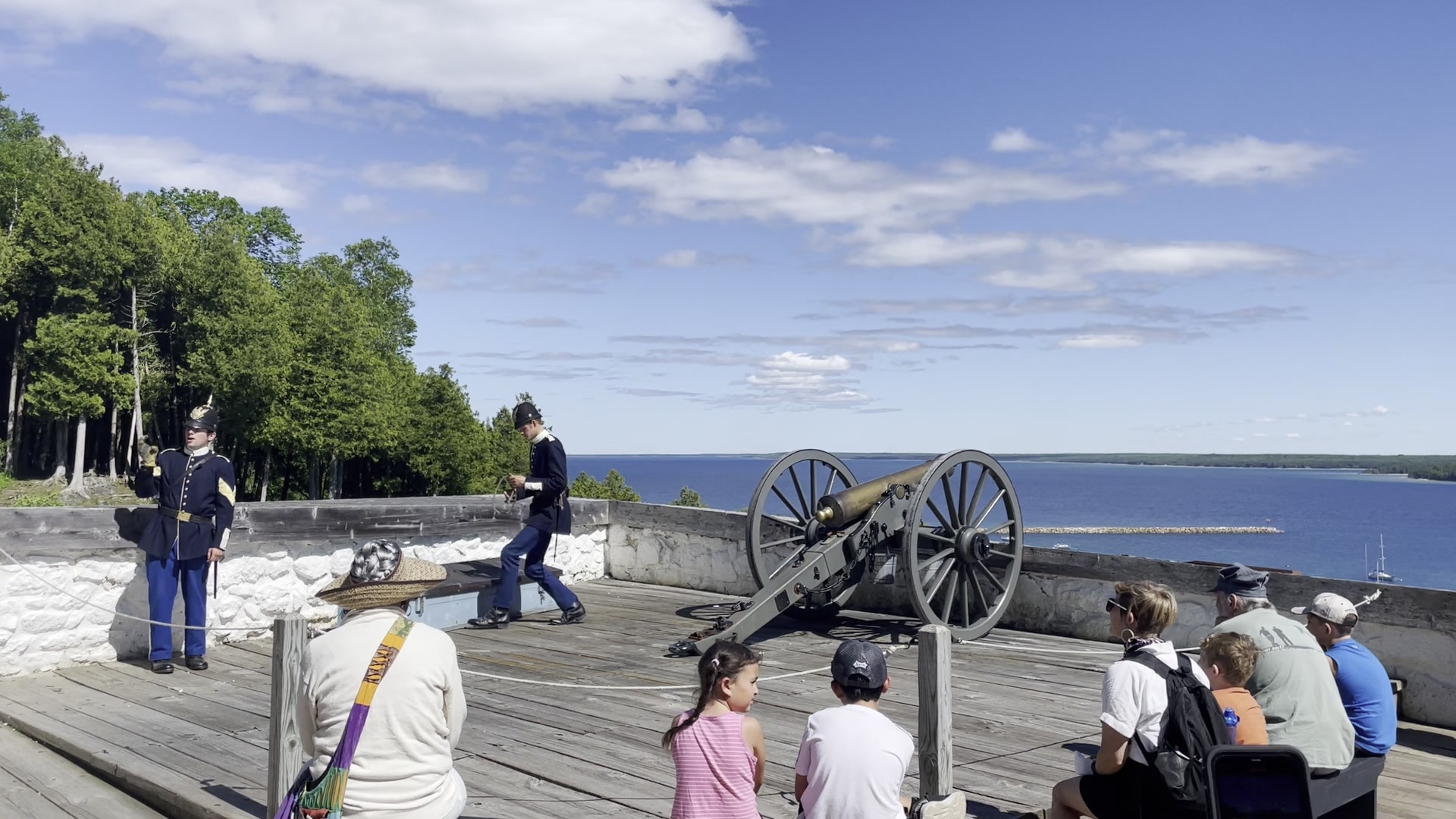 Costumed interpreters at Fort Mackinac cannon firing demonstration