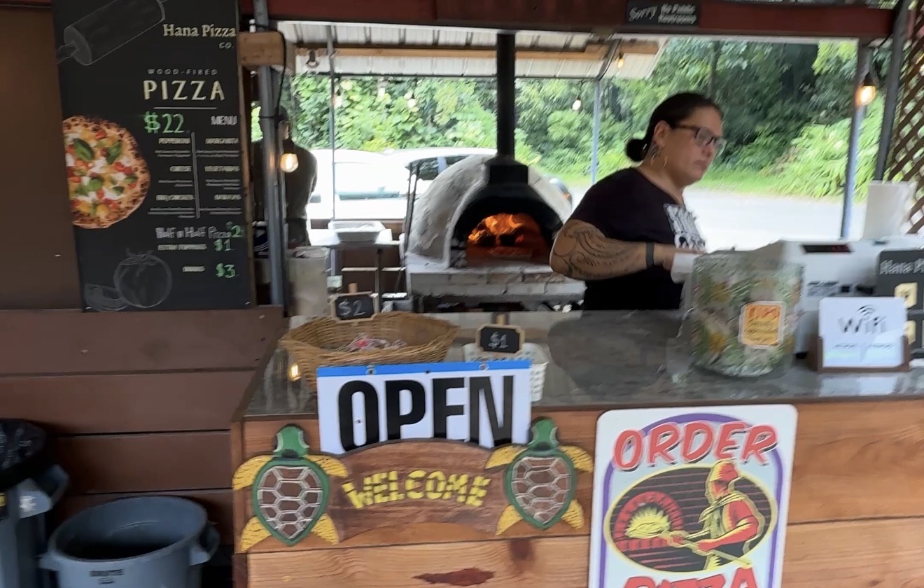 Hana Pizza Company counter and wood-fired pizza oven at Nahiku Marketplace on Maui's Road to Hāna